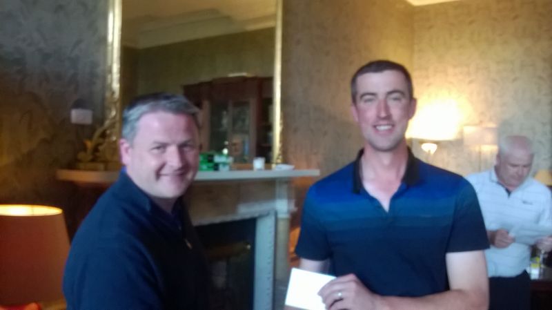 Brian Carroll presents to Druids Glen winner Brian Heverin (right).